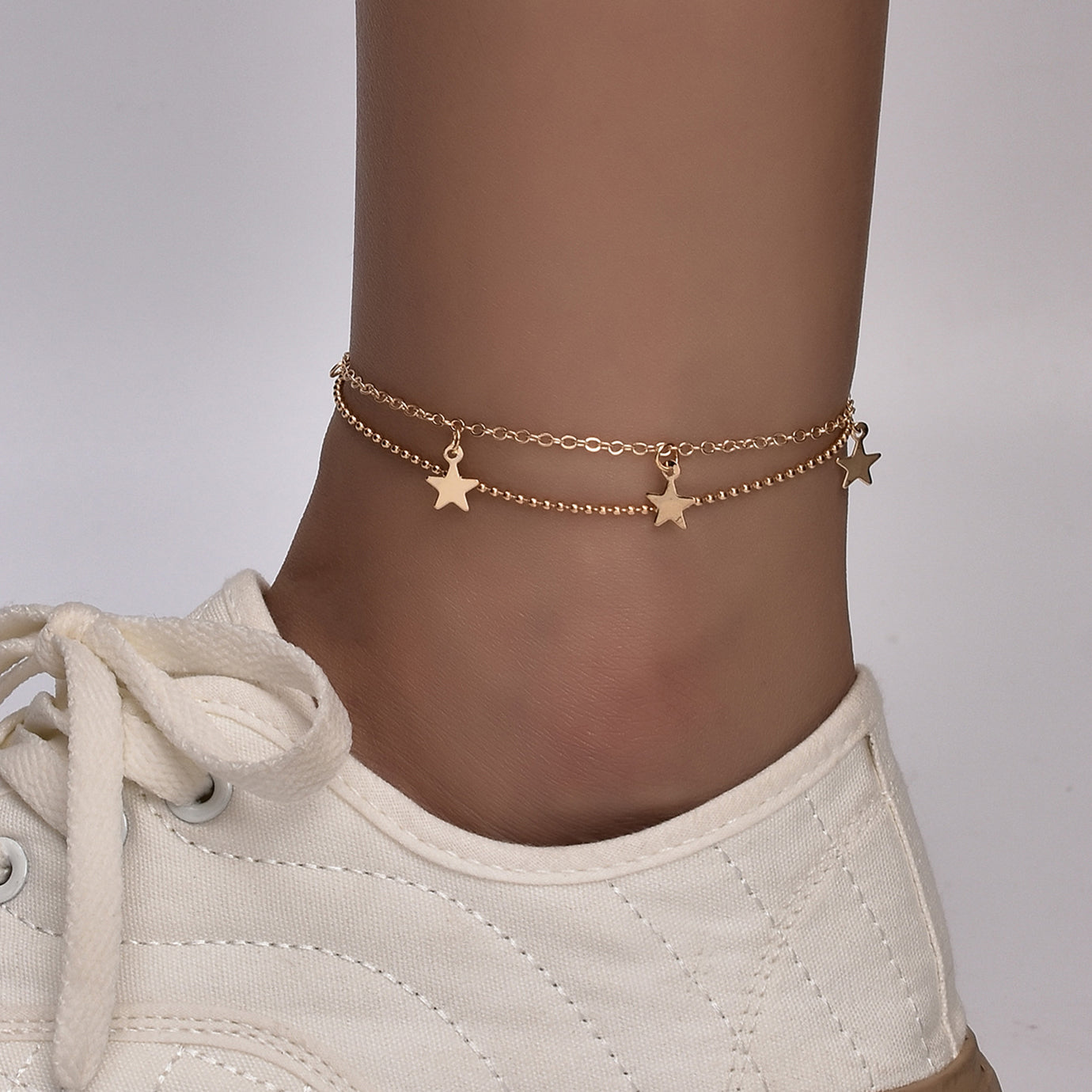 Boho Butterfly Charm Anklet in gold and silver, featuring a delicate butterfly design, adjustable length, and elegant packaging.