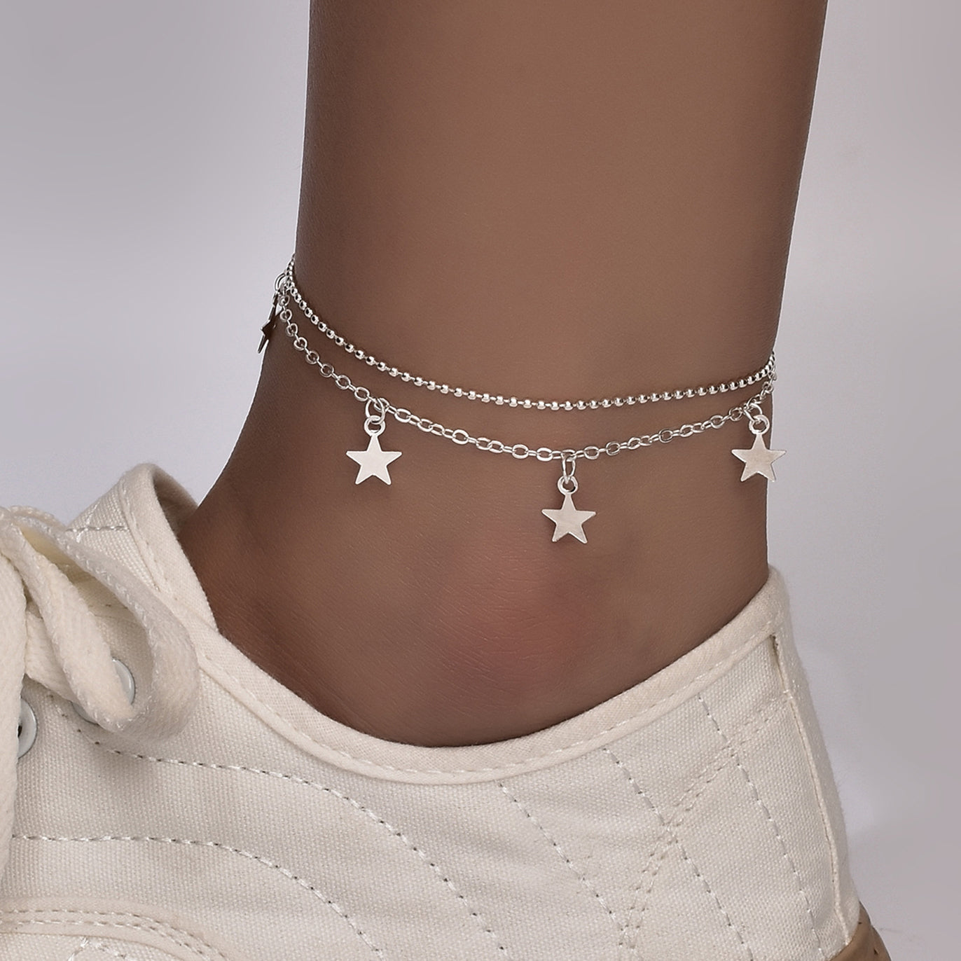 Boho Butterfly Charm Anklet in gold and silver, featuring a delicate butterfly design, adjustable length, and elegant packaging.