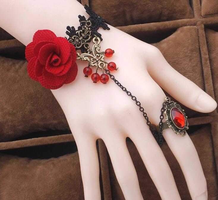 A beautiful Red Rose Ring Bracelet featuring a stunning rose design, crafted from high-quality alloy and lace, available in gold, red, and black colors.