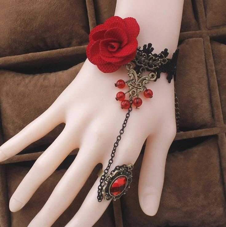 A beautiful Red Rose Ring Bracelet featuring a stunning rose design, crafted from high-quality alloy and lace, available in gold, red, and black colors.