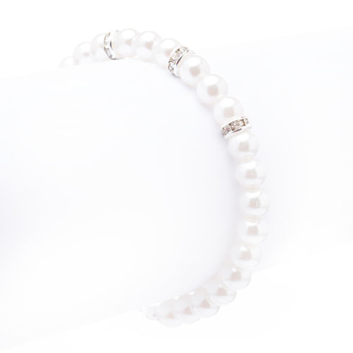 Elegant silver bridal bracelet featuring clear crystal stones, rhinestones, and white faux pearls in a linear design.