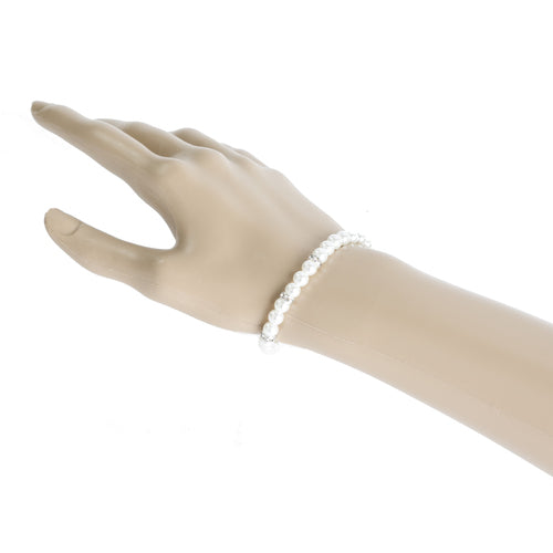 Elegant silver bridal bracelet featuring clear crystal stones, rhinestones, and white faux pearls in a linear design.