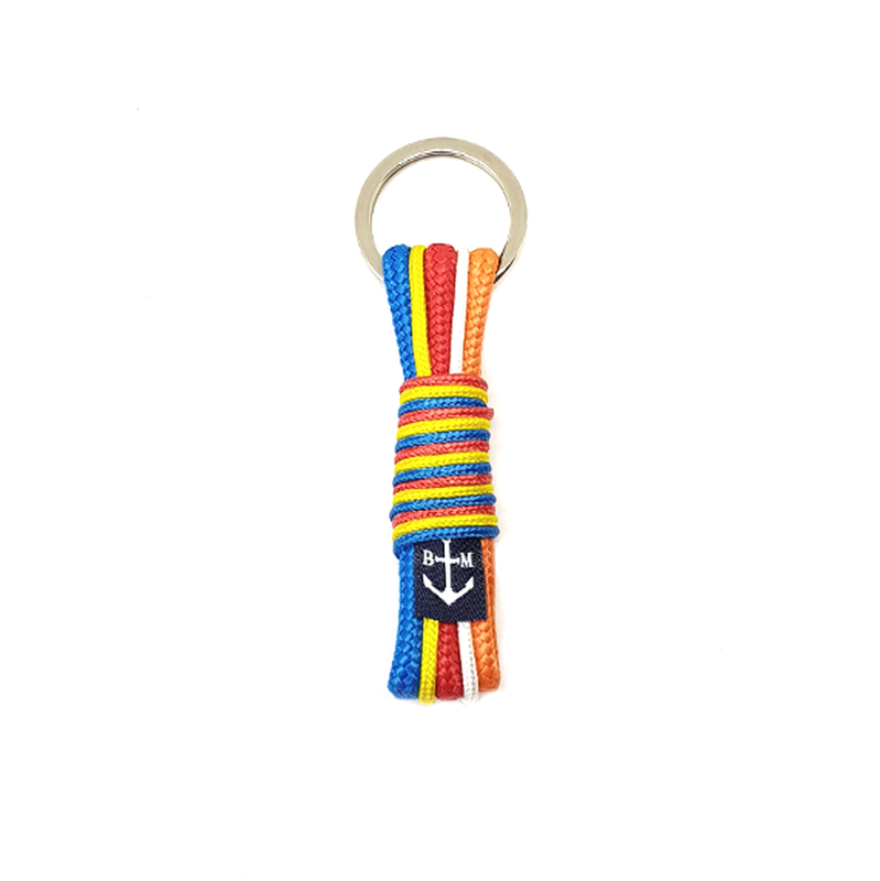 A vibrant handmade Buddhist Keychain featuring red, blue, white, orange, and yellow nautical ropes, showcasing intricate craftsmanship.