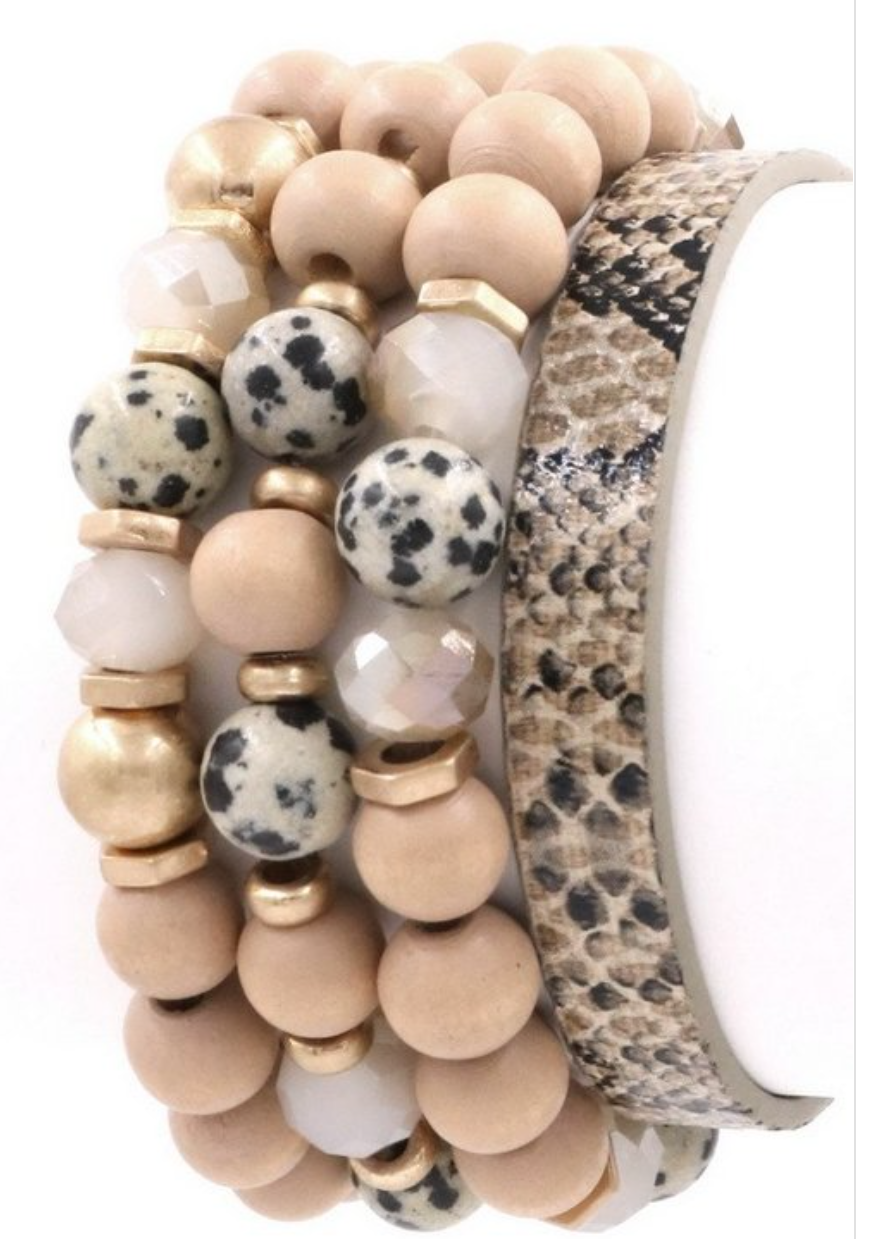 A stylish Dalmation Mixed Bracelet Set featuring multi-colored beads on elastic bands, perfect for layering and enhancing any outfit.