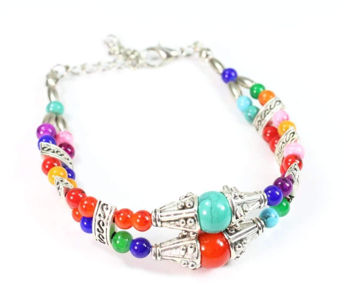 Double strand bracelet featuring multicolored marbled beads, silver tone cones, and rectangular charms, perfect for spring and summer fashion.