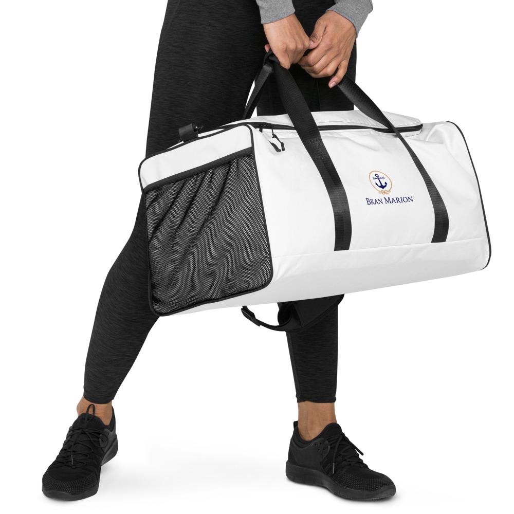 Duffle BM bag in black with multiple pockets and adjustable strap, ideal for travel and daily use.