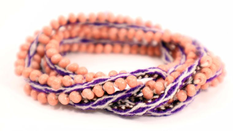 Dusty Rose Beaded Tie Wraps featuring handwoven alpaca blend textile and Czech beads in shades of purple.