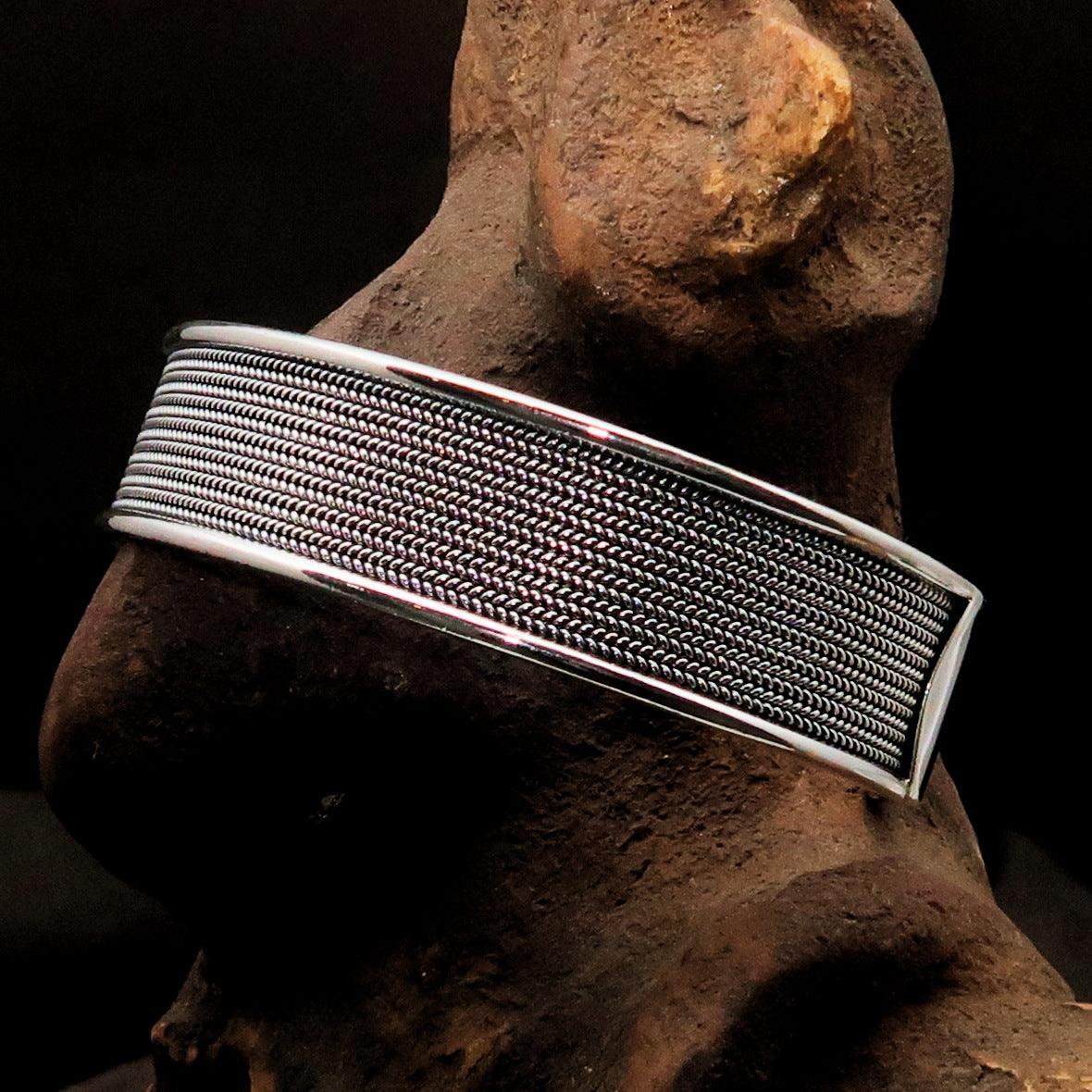 A beautifully handcrafted minimalistic sterling silver bracelet, showcasing its elegant design and hallmark 925.