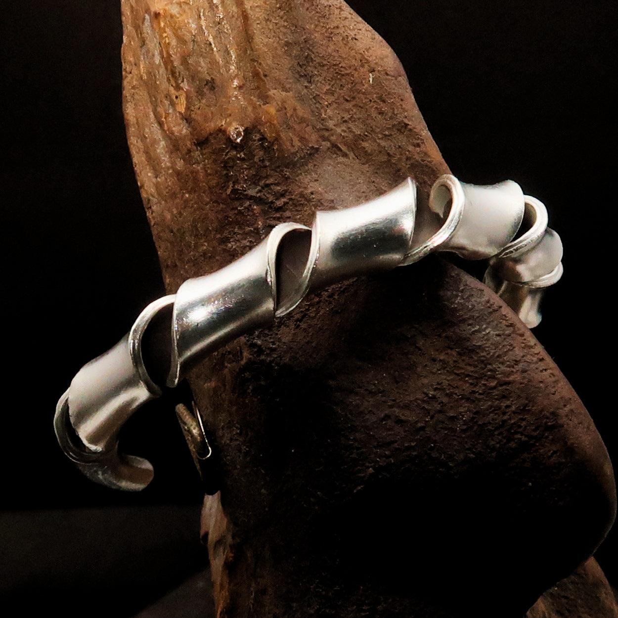 A beautifully handcrafted TWISTED Sterling Silver Bracelet showcasing its elegant twisted design and hallmark 925.