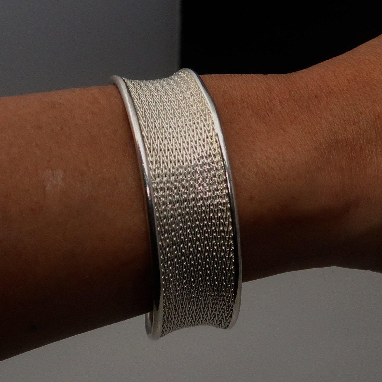 A beautifully handcrafted woven Sterling Silver Bracelet Bangle with a 925 hallmark, showcasing intricate design and comfortable fit.