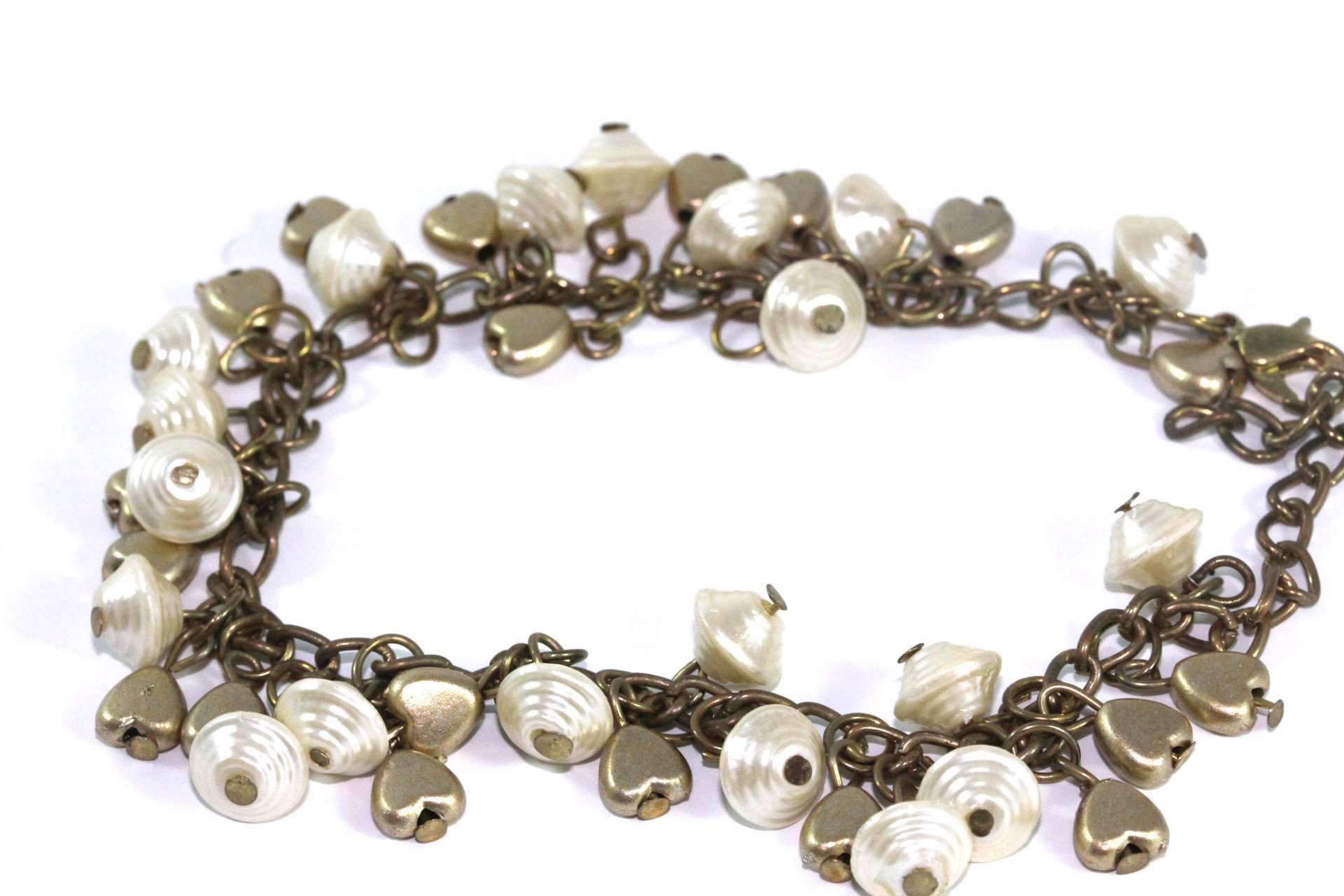 Golden Hearts & Shells Charm Bracelet featuring antique gold tone, mother of pearl shells, and golden heart charms.