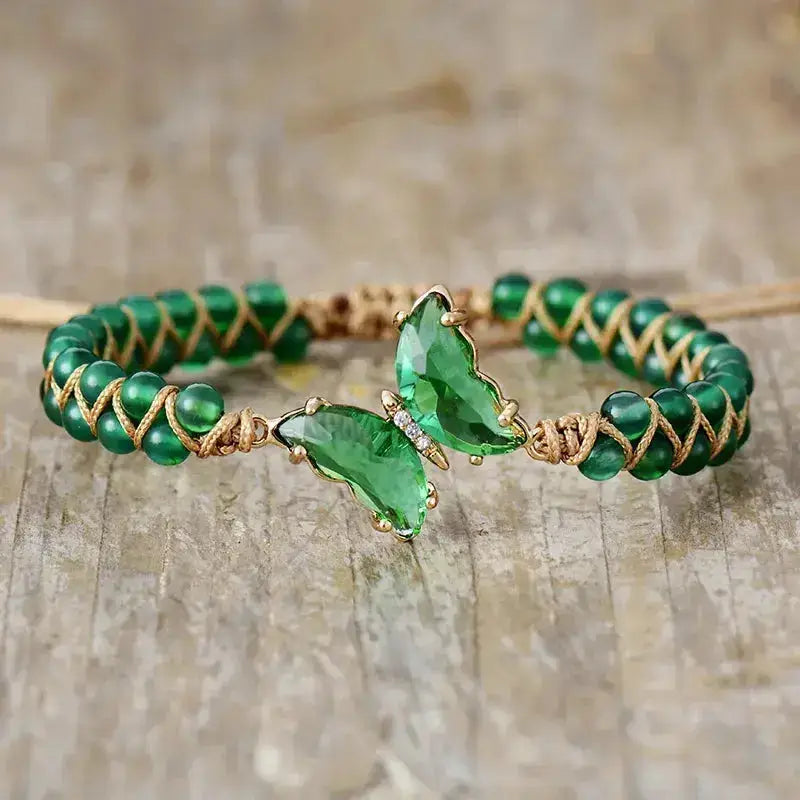 A handmade Green Agate Crystal Butterfly Bracelet featuring green agate stones and a butterfly charm, showcasing its bohemian style.