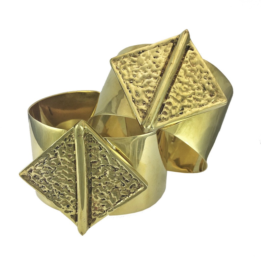 Hammered Bombshell Cuff made from recycled brass bombshells, showcasing a unique hammered design, adjustable for any wrist size.