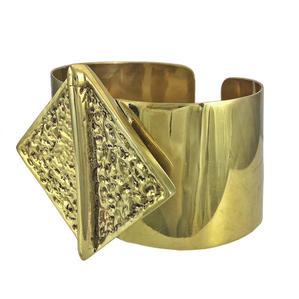 Hammered Bombshell Cuff made from recycled brass bombshells, showcasing a unique hammered design, adjustable for any wrist size.