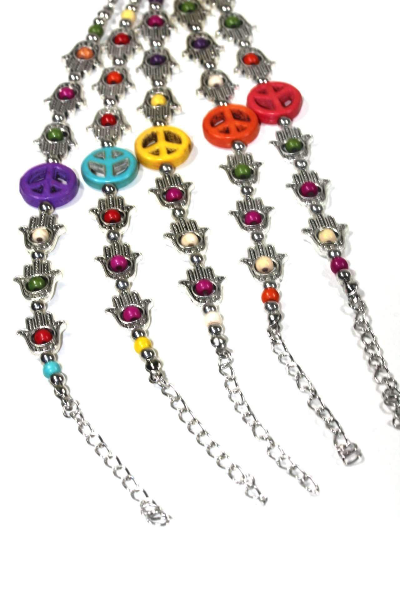 A stylish silver tone bracelet featuring Hamsa Hand and peace charms, adorned with colorful beads in a boho style.