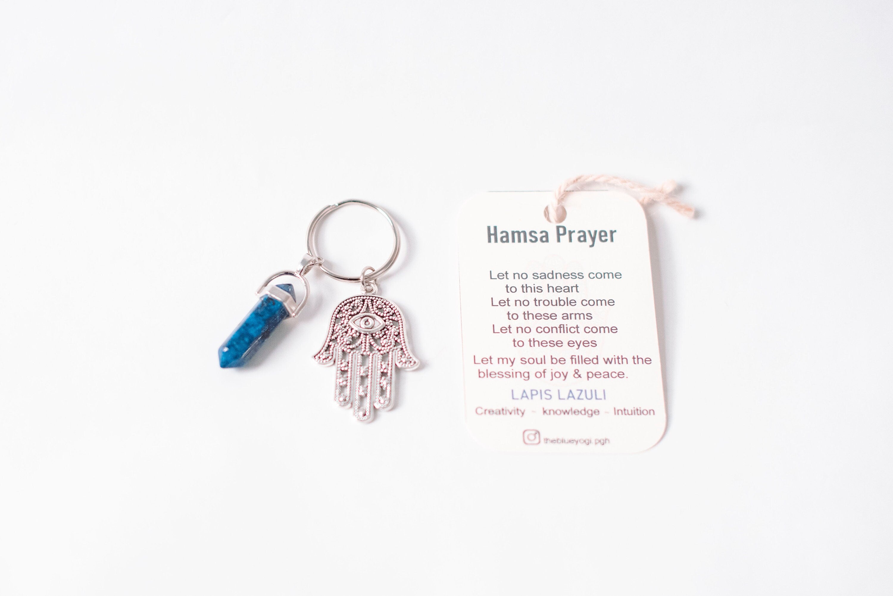 Hamsa & Lapis Lazuli Keychain featuring a hexagonal stone and charm, accompanied by a Hamsa prayer card.