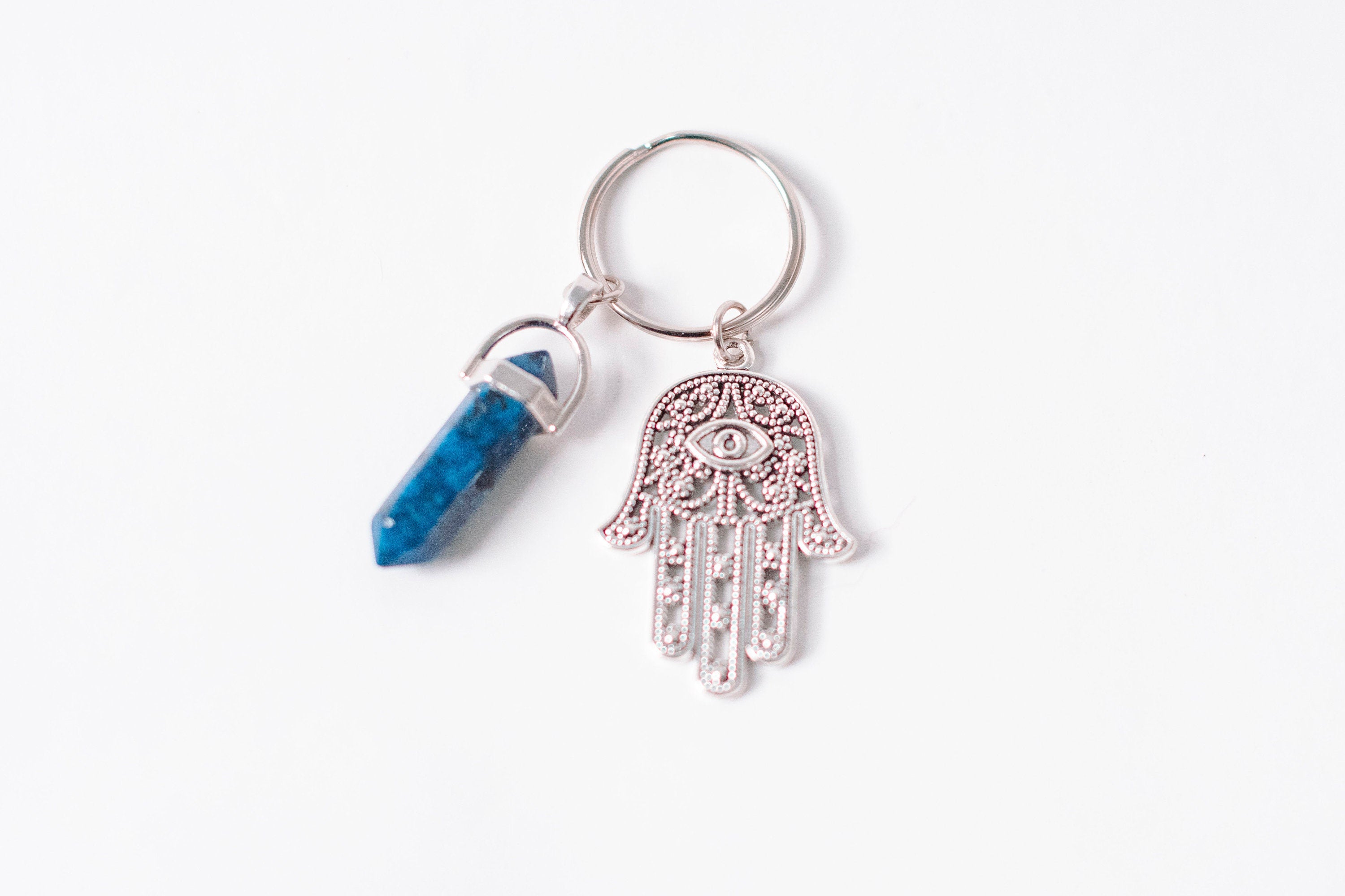 Hamsa & Lapis Lazuli Keychain featuring a hexagonal stone and charm, accompanied by a Hamsa prayer card.