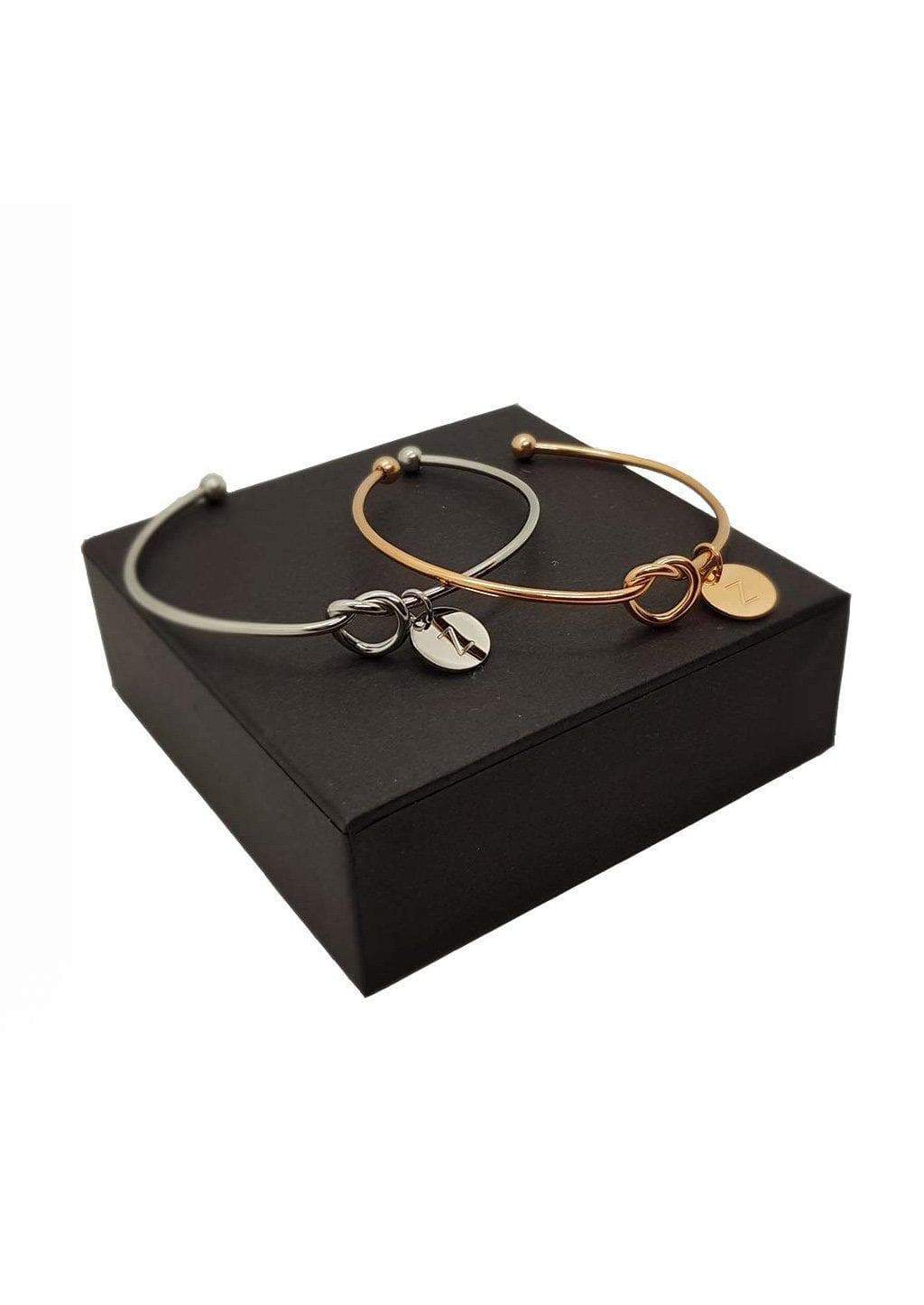 Elegant Knot Bangle featuring an infinity symbol, crafted from rose gold plated Zinc Alloy, perfect for stacking with other bracelets.