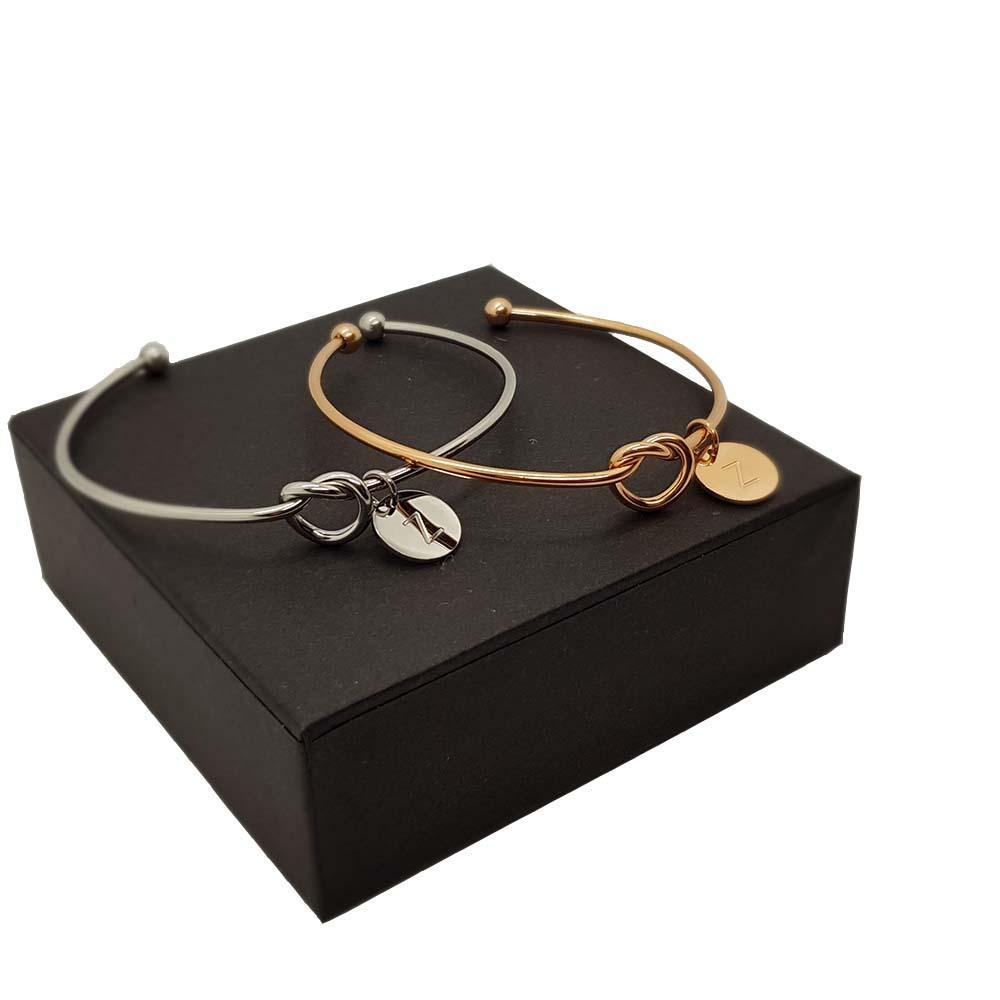 Elegant Knot Bangle featuring an infinity symbol, crafted from rose gold plated Zinc Alloy, perfect for stacking with other bracelets.