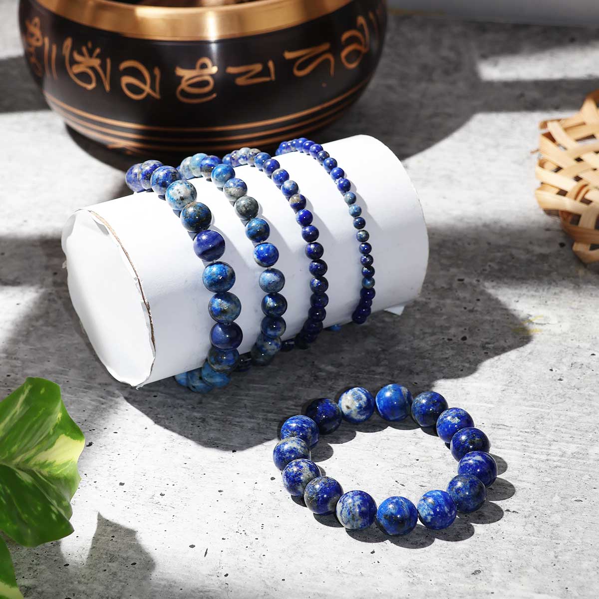 Lapis Lazuli Round Beads Bracelet showcasing deep blue beads with gold flecks, elegantly strung on elastic for a comfortable fit.