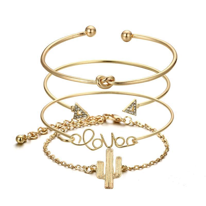 A stylish Love Bracelet Stack featuring four unique bracelets with charms: 'love', a knot, a cactus, and two arrows, made from crystal and zinc alloy.