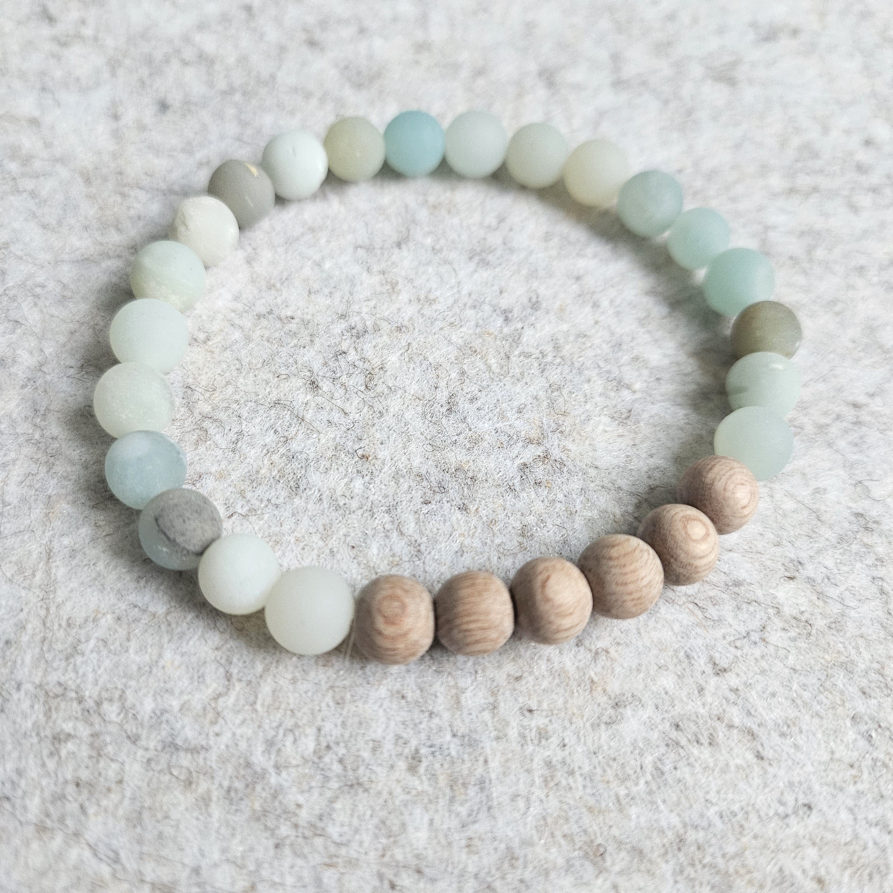 A close-up of a Matte Amazonite and Rosewood Aromatherapy Bracelet showcasing its natural beads and diffuser capabilities.