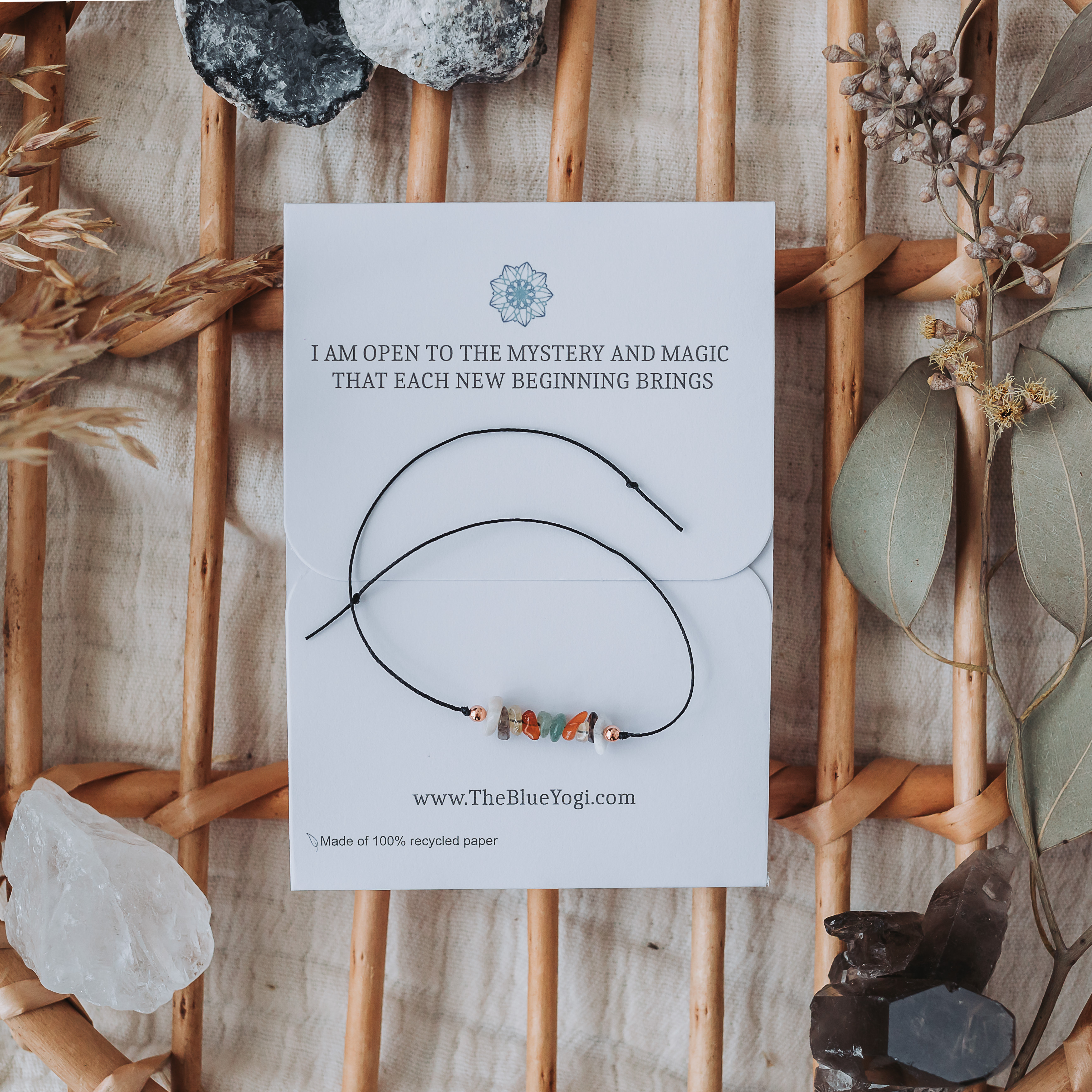 New Beginnings crystal bracelet made of natural gemstones and hemp cord, featuring a tie closure and a Mandala art card with healing properties.