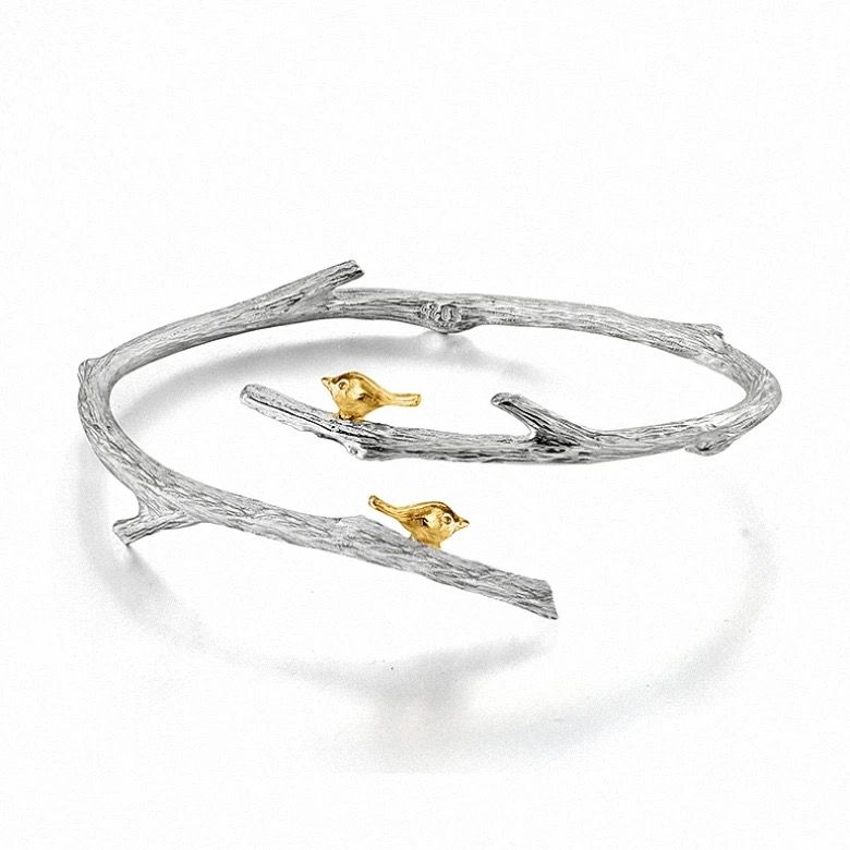 A beautiful silver bracelet featuring an 18K gold-plated butterfly, showcasing intricate detailing and nature-inspired design.