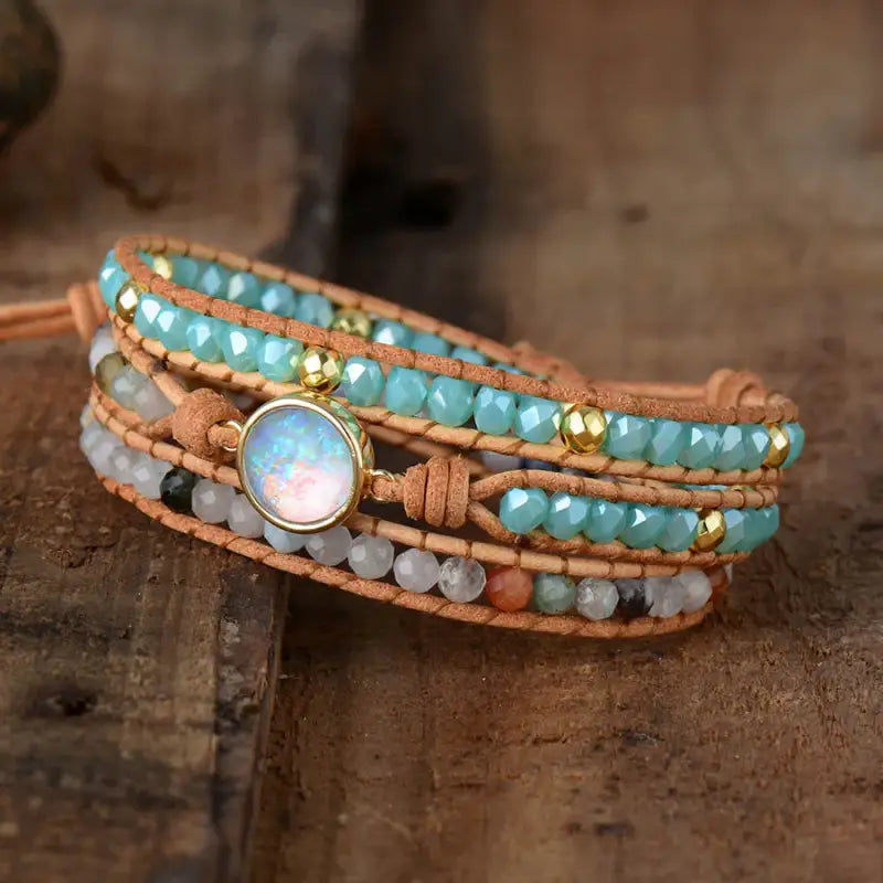 A beautifully handcrafted Opal Bracelet featuring iridescent opal gemstones in a bohemian style, showcasing vibrant colors and unique patterns.