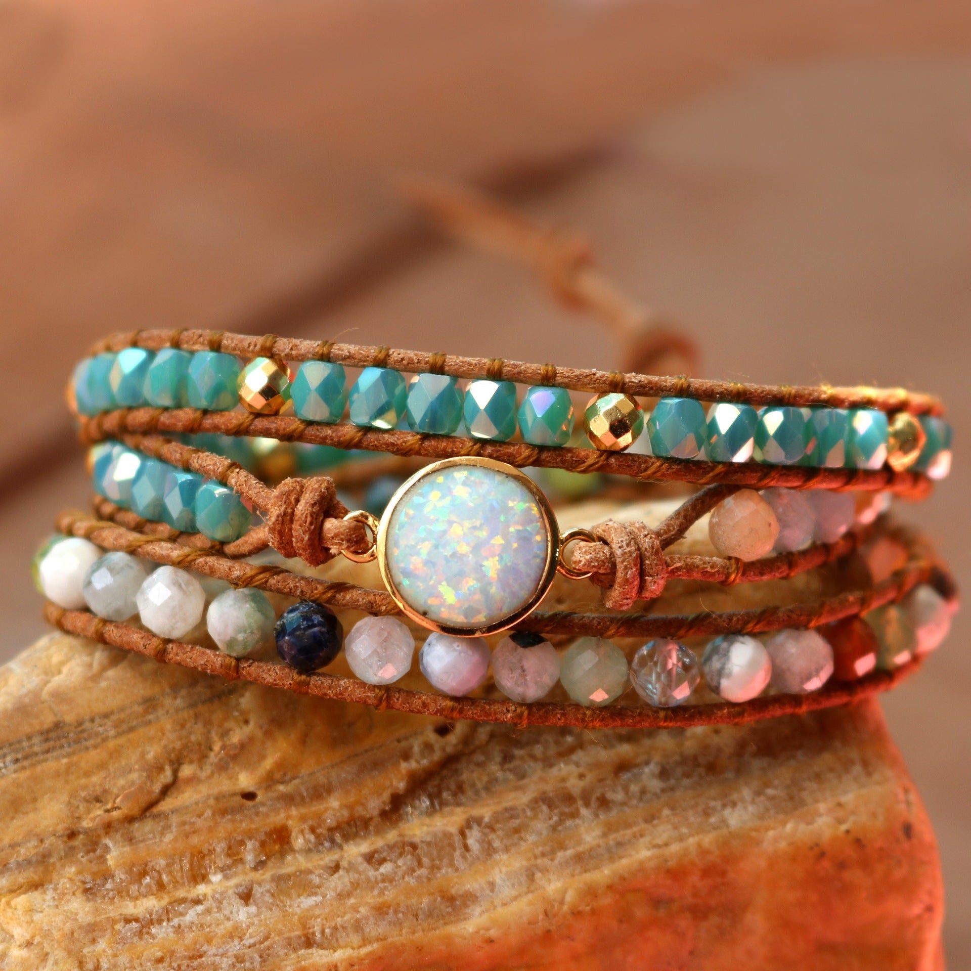 A beautifully handcrafted Opal Bracelet featuring iridescent opal gemstones in a bohemian style, showcasing vibrant colors and unique patterns.