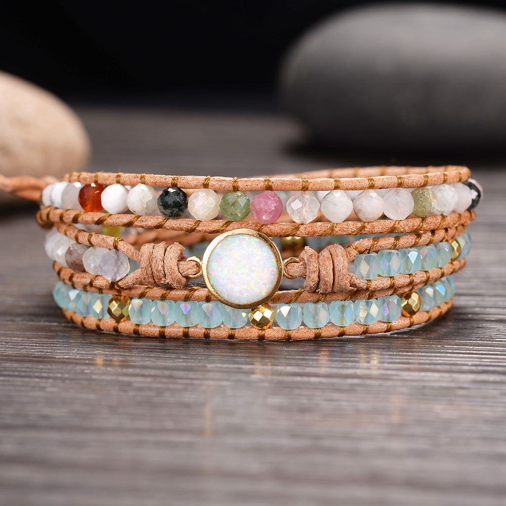 A beautifully handcrafted Opal Bracelet featuring iridescent opal gemstones in a bohemian style, showcasing vibrant colors and unique patterns.