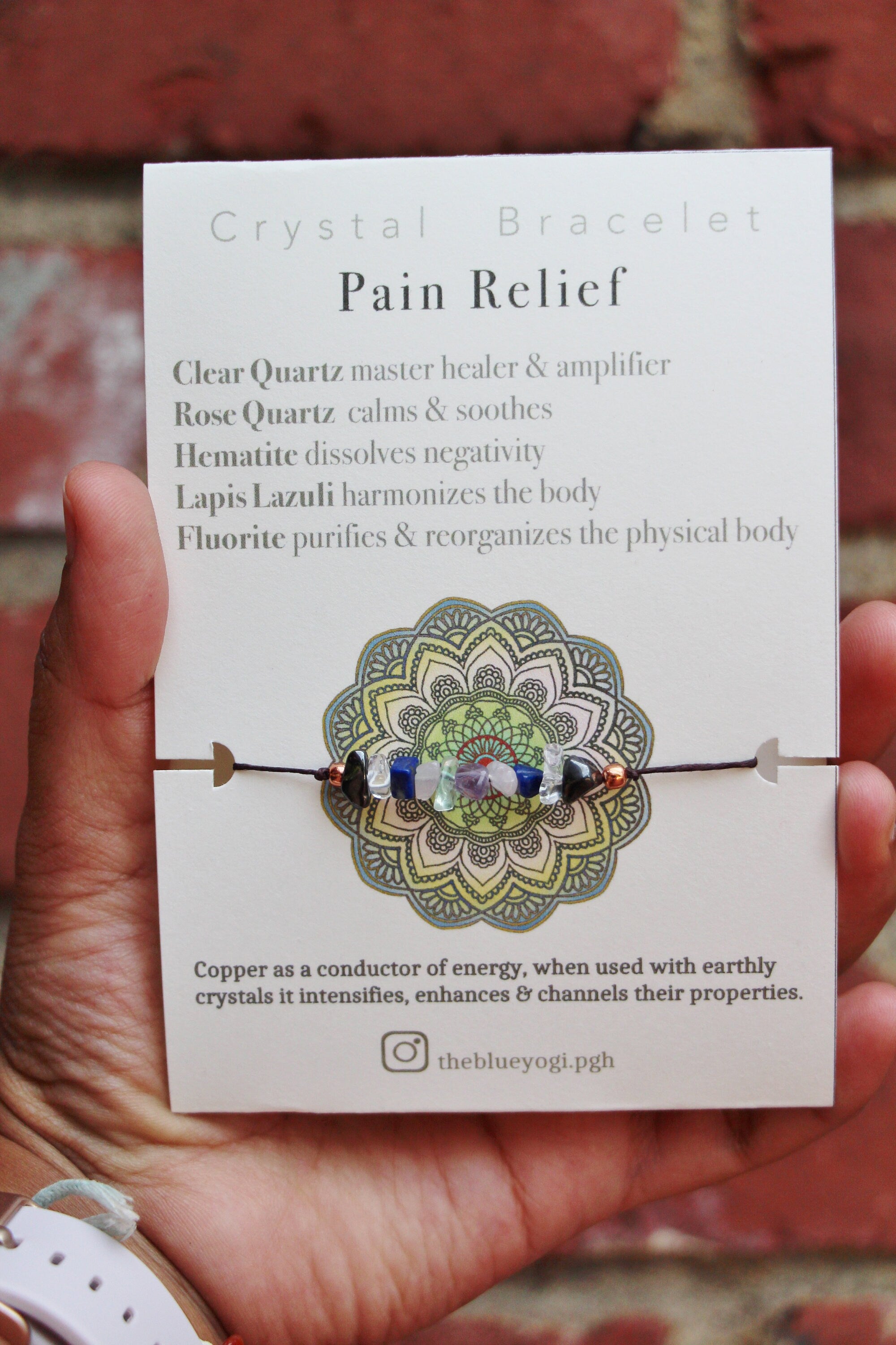 Eco-friendly Pain Relief crystal bracelet anklet made of natural gemstones with a tie closure, showcasing unique crystals and a watercolor Mandala card.