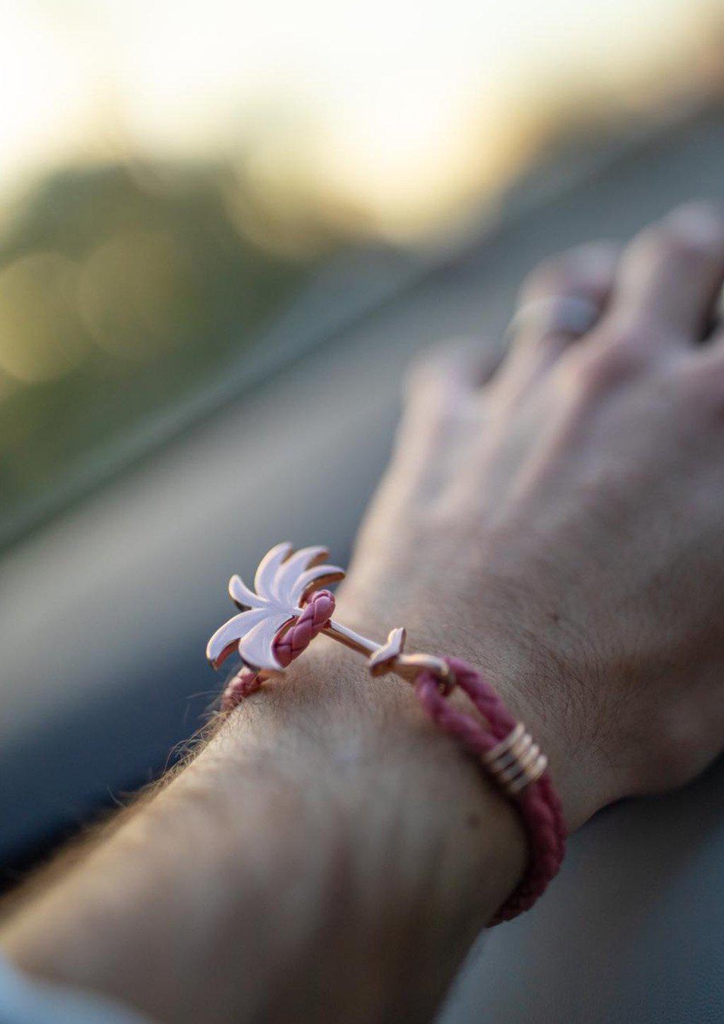 Flamingo Rose Palm Band bracelet featuring a rose gold palm tree charm on genuine pink braided leather.