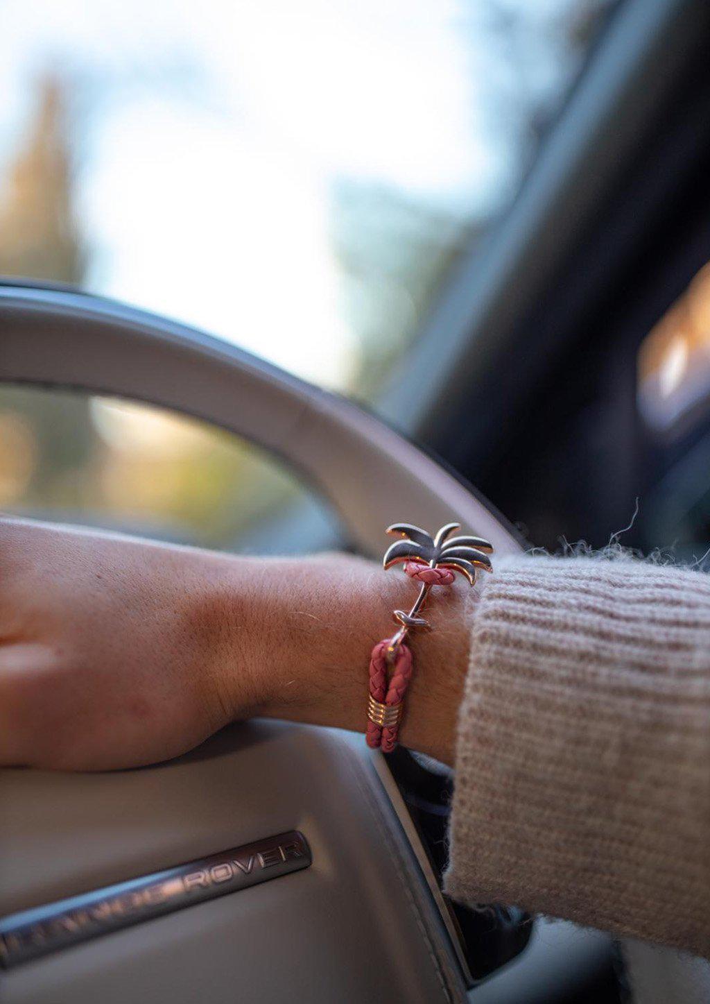 Flamingo Rose Palm Band bracelet featuring a rose gold palm tree charm on genuine pink braided leather.