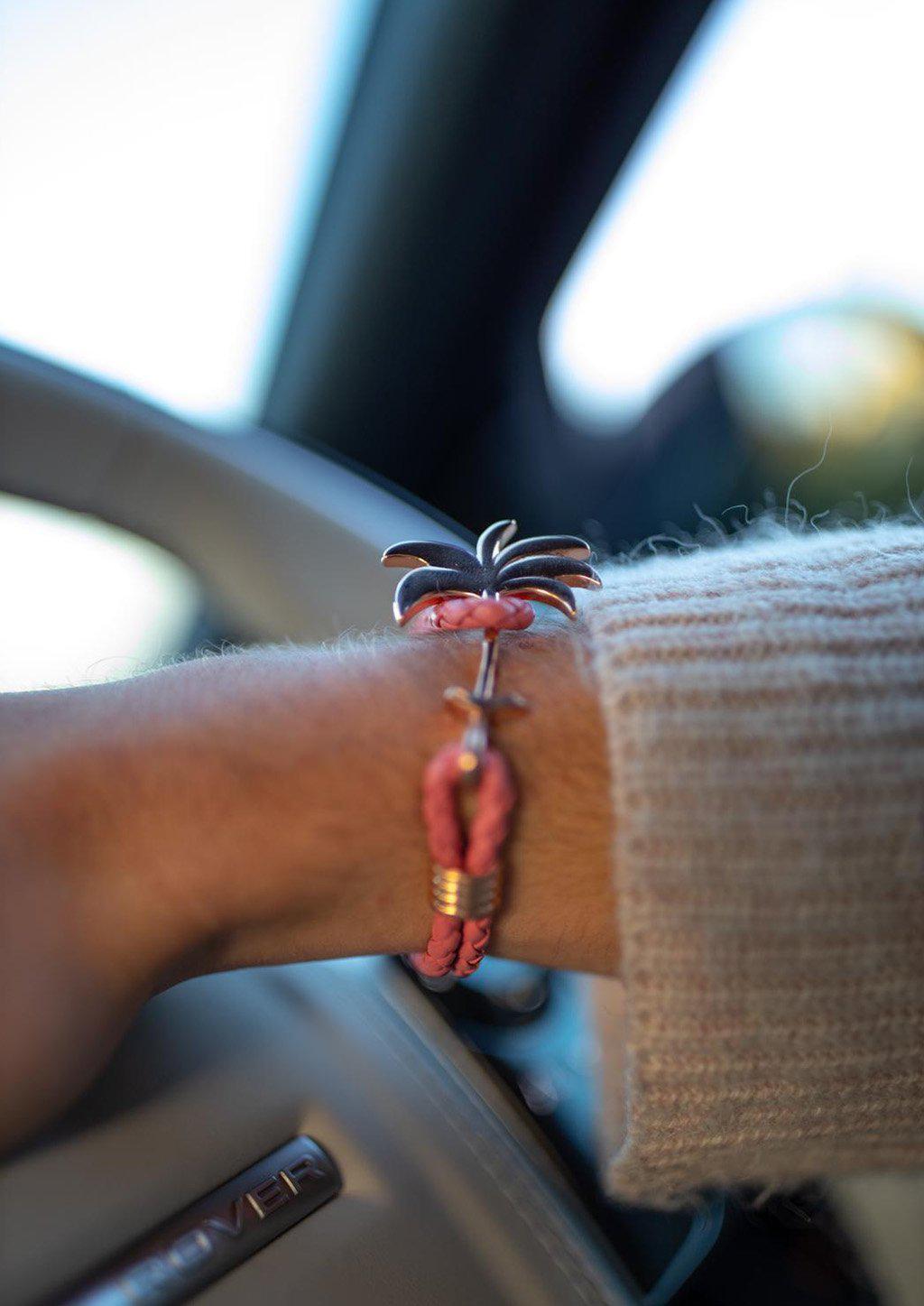 Flamingo Rose Palm Band bracelet featuring a rose gold palm tree charm on genuine pink braided leather.