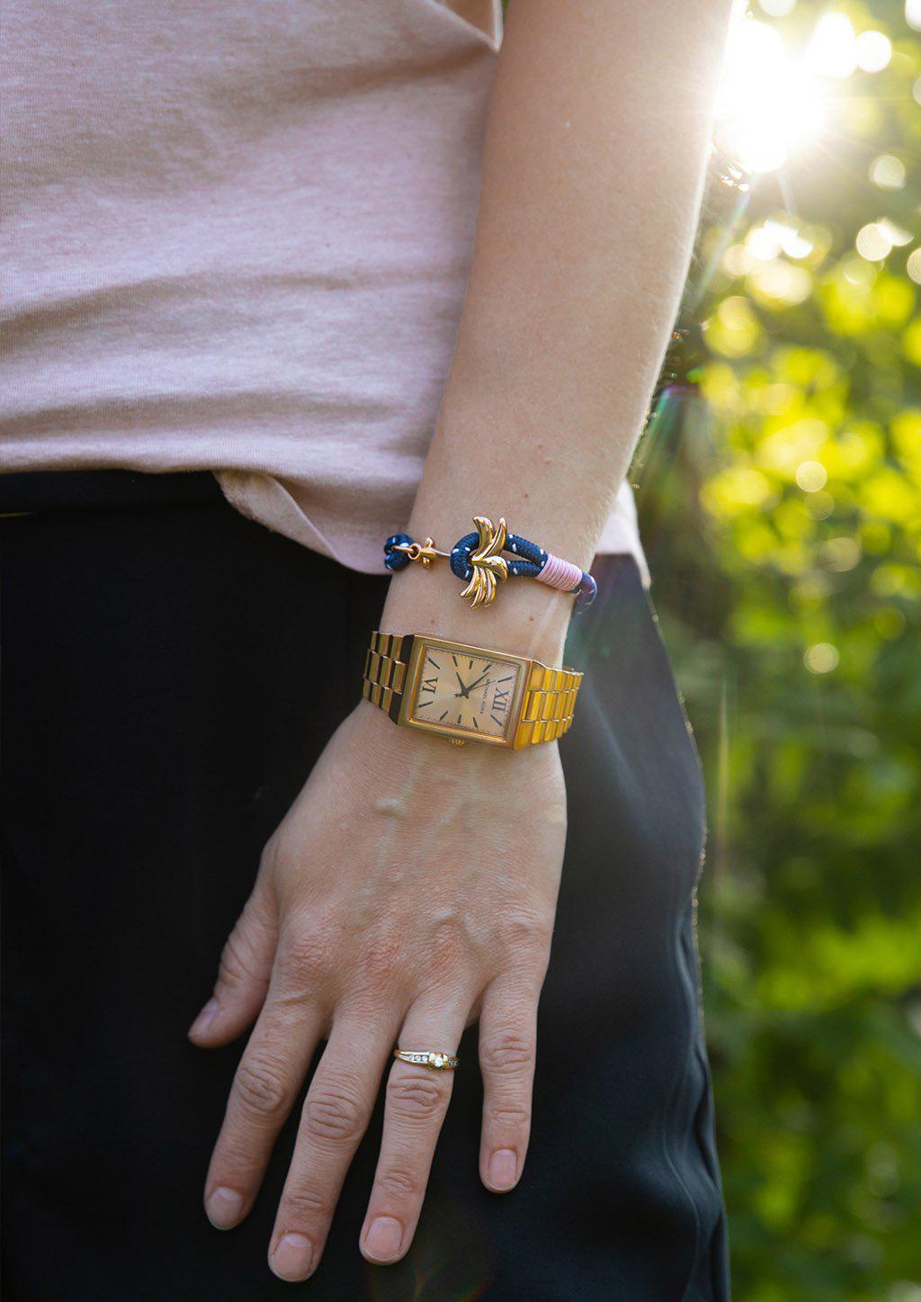 Daybreak Palm Band bracelet featuring a blue and pink nylon design with a unique rose palm tree anchor.