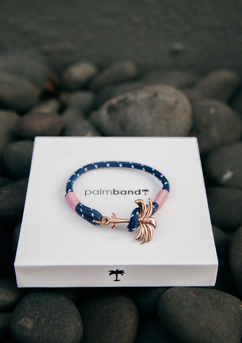 Daybreak Palm Band bracelet featuring a blue and pink nylon design with a unique rose palm tree anchor.