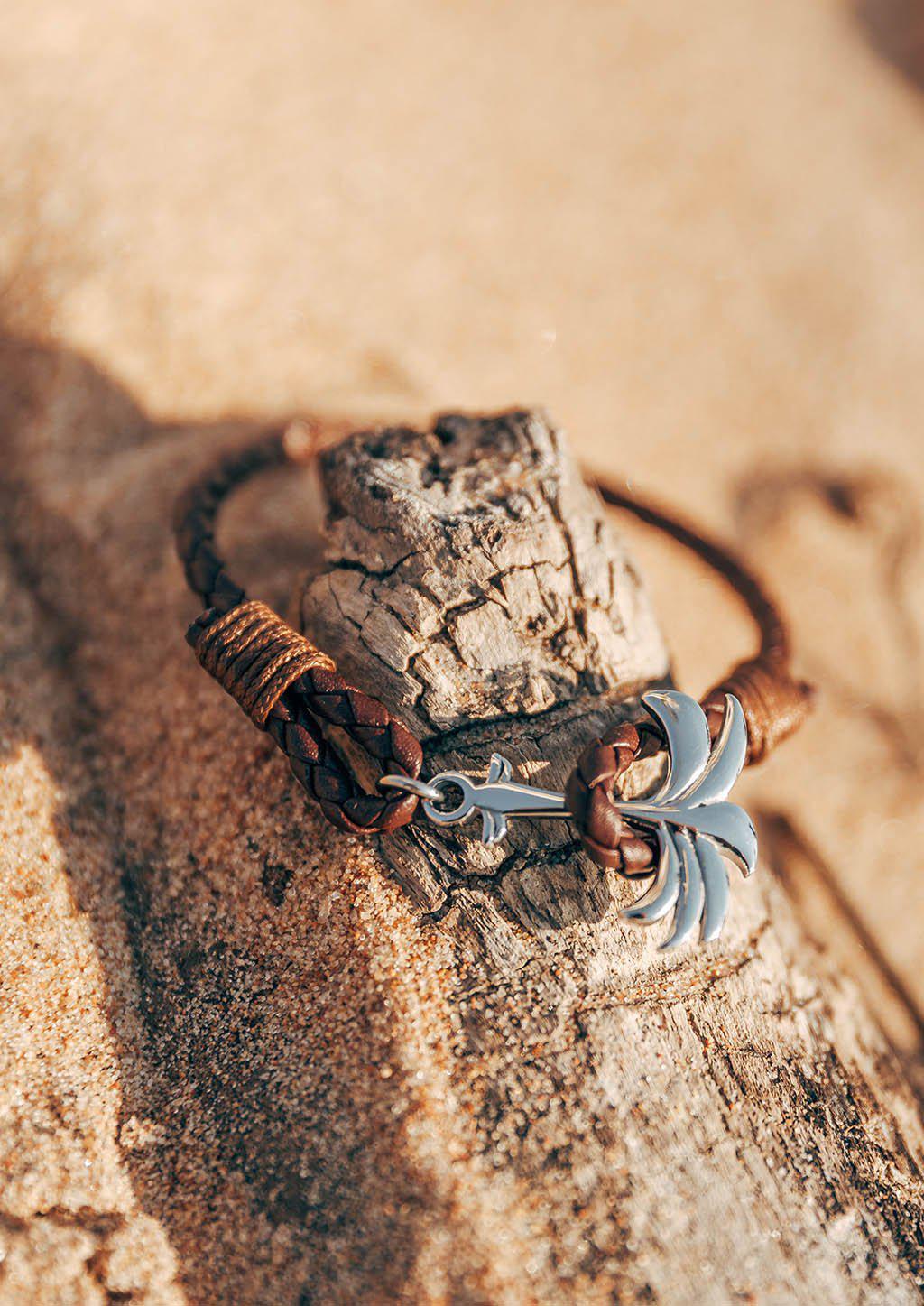 Oakland Palm Band featuring a brown leather strap and silver palm tree anchor, symbolizing happiness and tranquility.