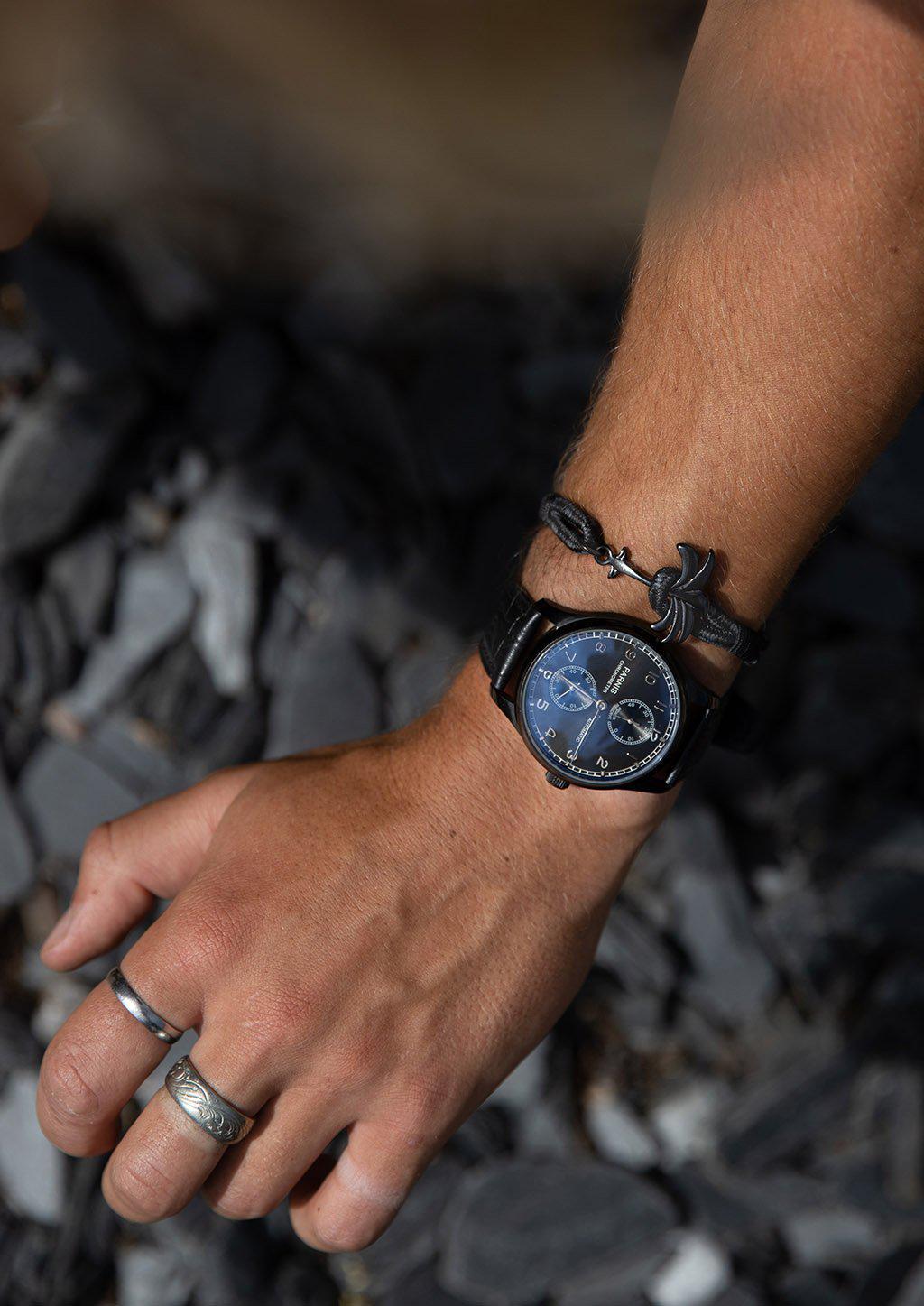 Palmband - Phantom Black bracelet featuring a black palm tree anchor on a black and gray nylon band, symbolizing happiness and tranquility.