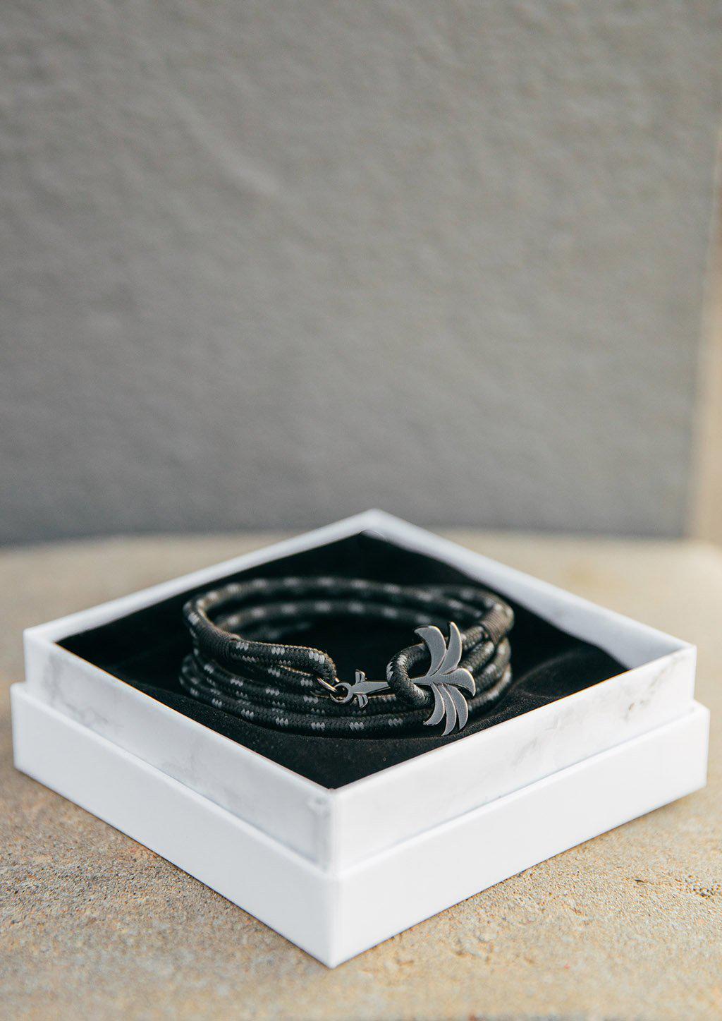 Palmband - Phantom Black - Triple bracelet featuring a black palm tree anchor and a durable black and gray nylon band.