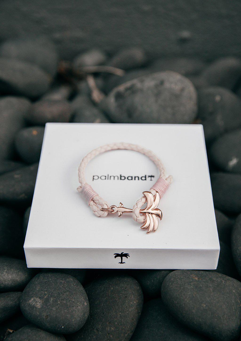 Rosette Palm Band featuring a pink leather strap and rose gold palm anchor, symbolizing happiness and tranquility.