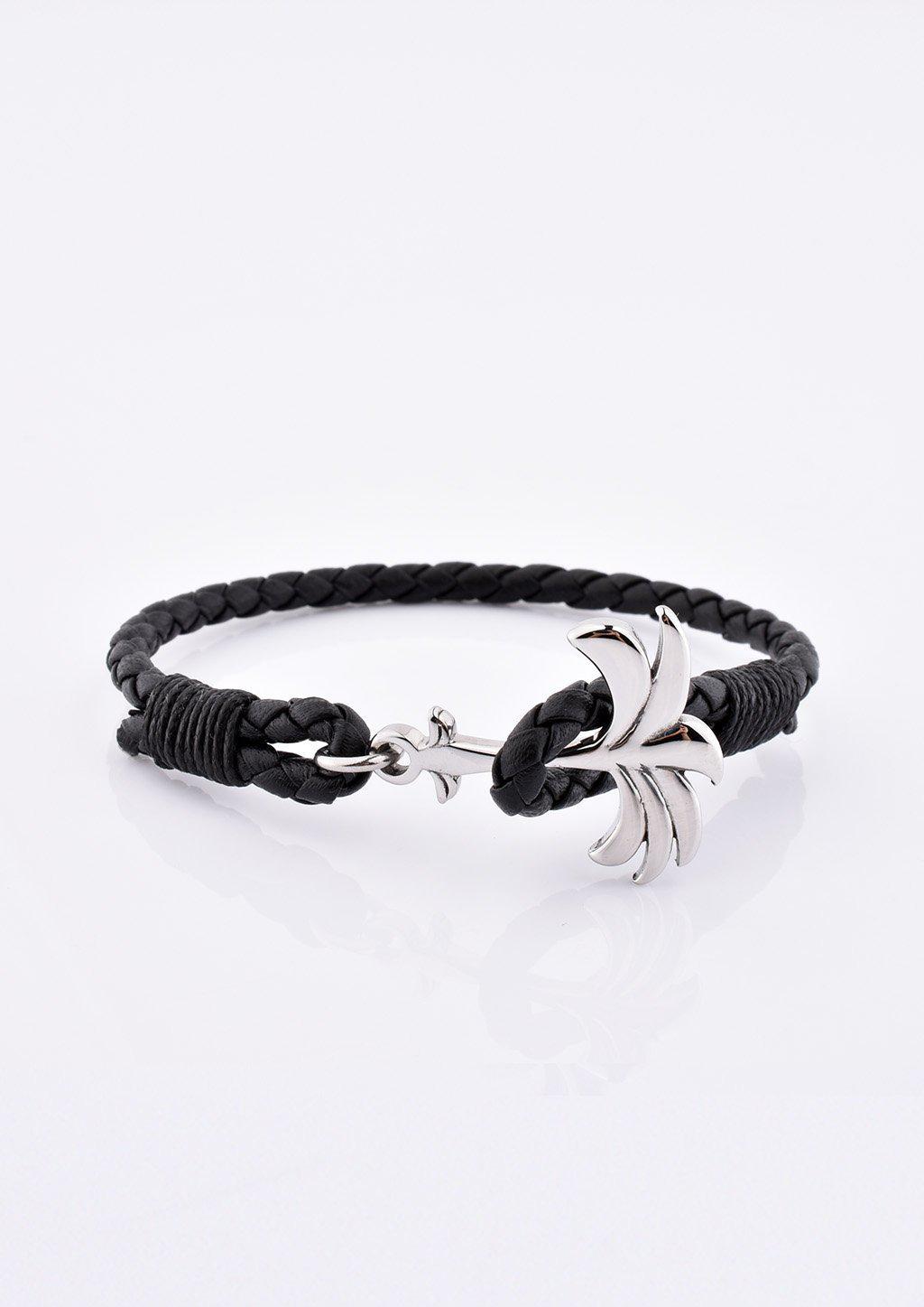 Palmband - Starlight featuring a braided black leather band and a unique palm tree anchor design.