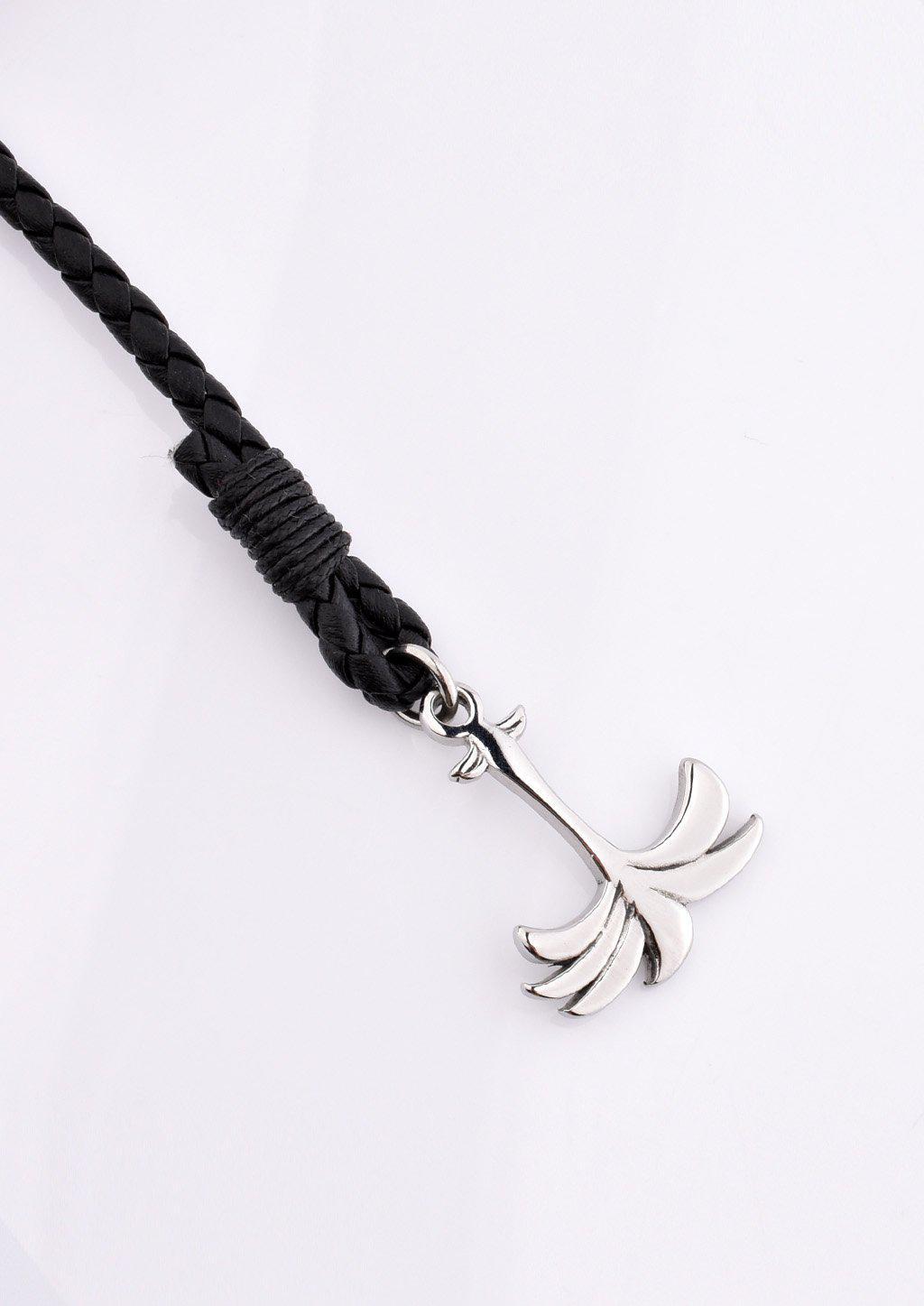 Palmband - Starlight featuring a braided black leather band and a unique palm tree anchor design.