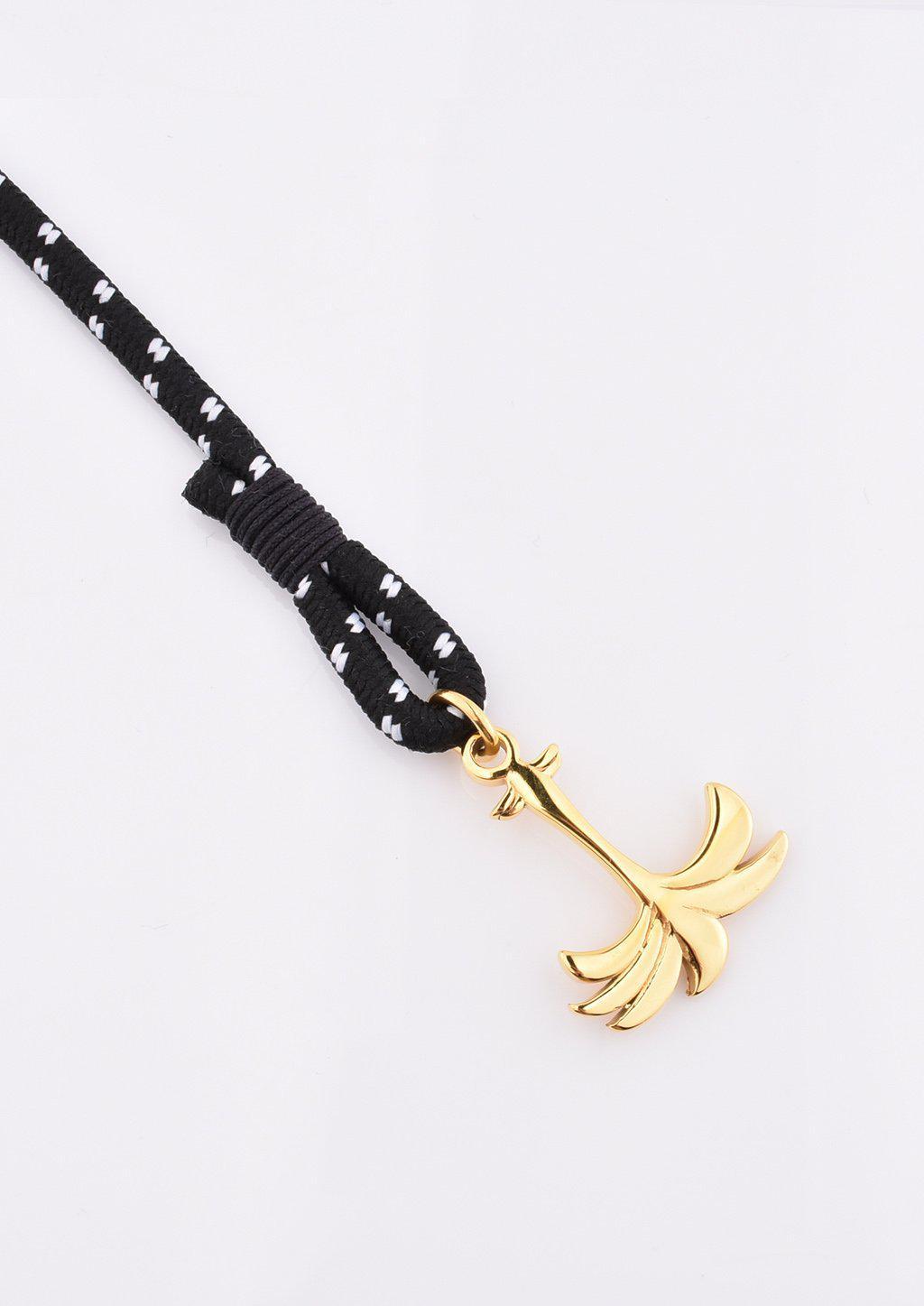 Trophy Palm Band featuring a gold palm tree anchor on a black and white nylon rope, symbolizing positivity and success.