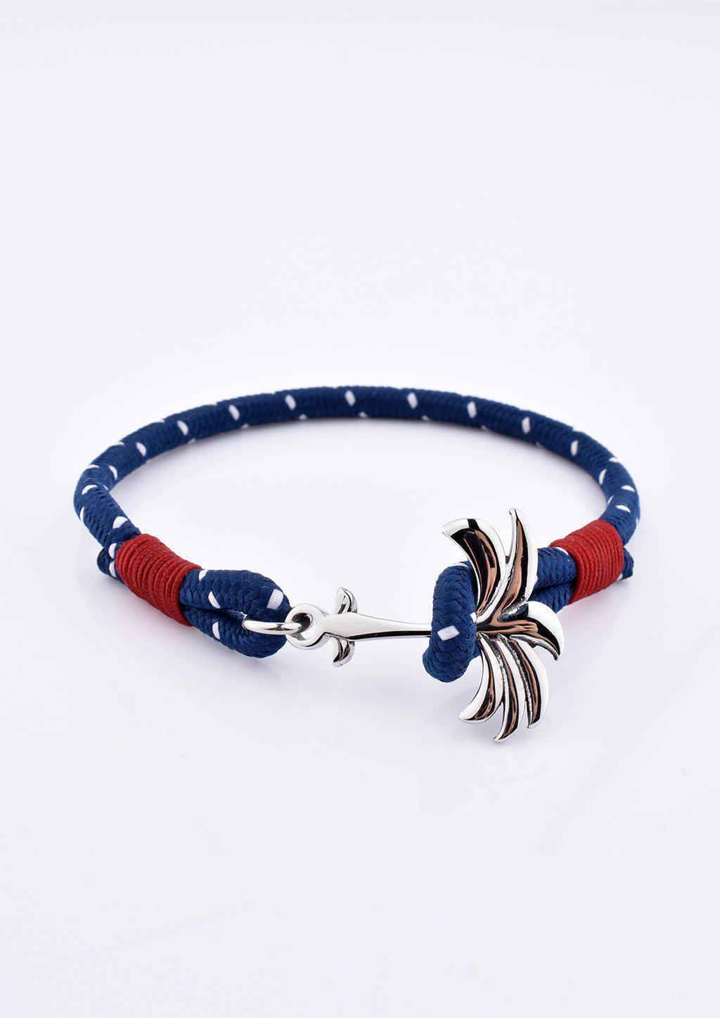 Voyager Palm Band featuring a silver palm tree anchor on a blue and red nylon rope, symbolizing adventure and happiness.