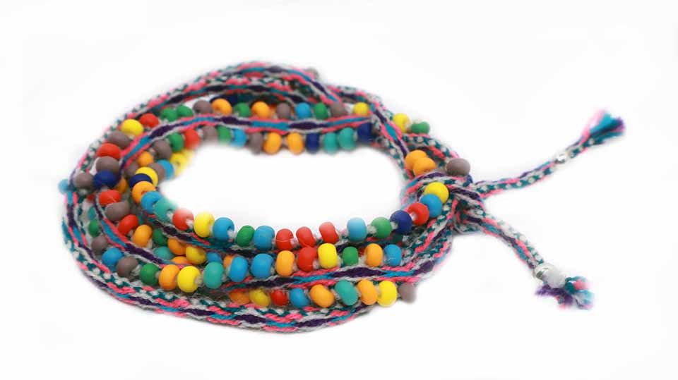 Colorful Rainbow Beaded Cotton Candy Tassel Tie Wraps showcasing intricate design and craftsmanship.