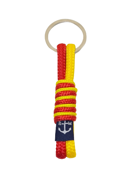 A vibrant Red & Yellow Keychain made from high-quality nautical ropes with a stainless steel anchor and ring, perfect for stylish key organization.