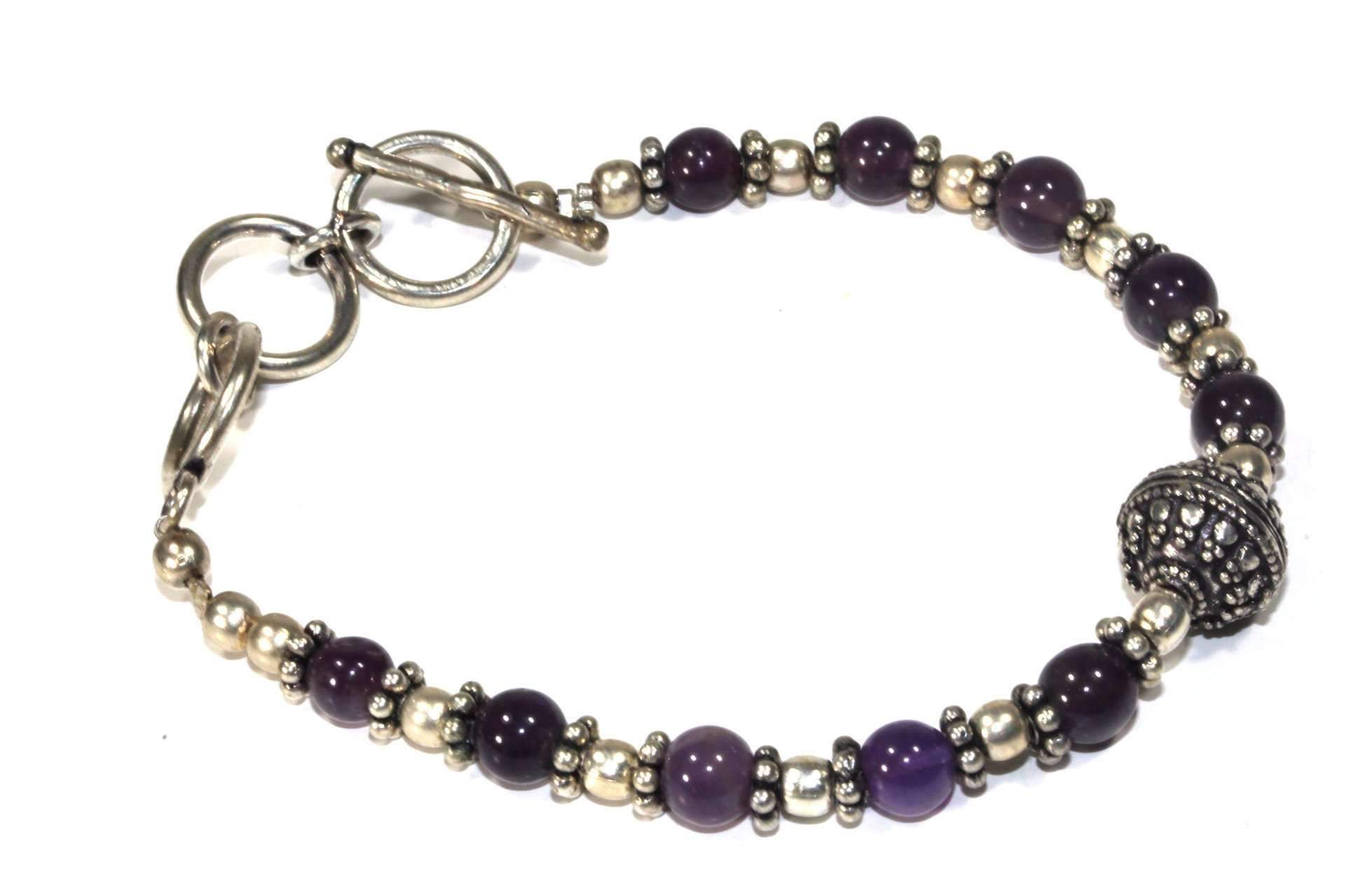 Regal Purple Beads & Charm Bracelet featuring deep purple hues and antique finish with a scroll work ball charm.