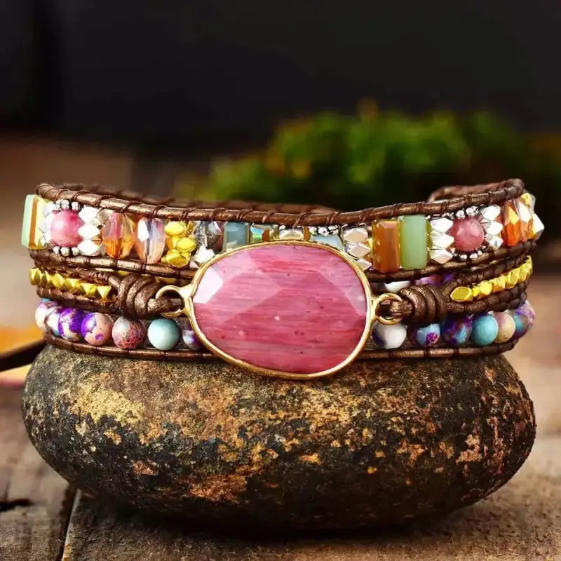 Elegant Rhodonite Bracelet featuring semi-precious stones in pink and black hues, designed for women with an adjustable size.