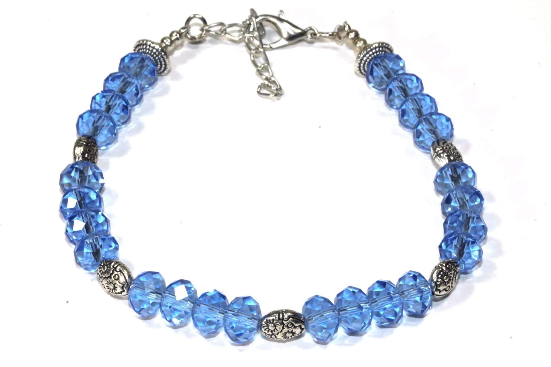 A beautiful Sparkly Crystal Beads Bracelet featuring blue and green crystals with silver-tone flower charms, showcasing elegance and sparkle.